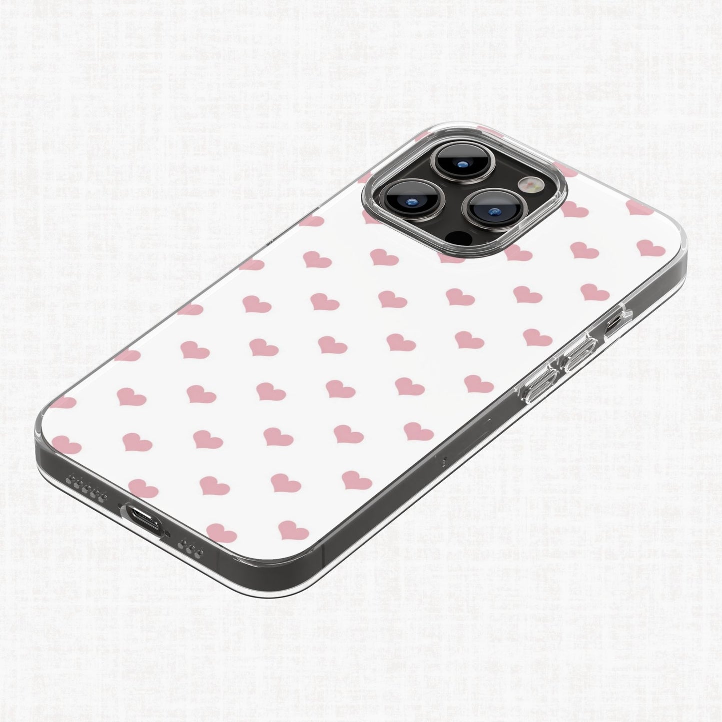 Blush pink heart pattern shown applied to a clear phone case as an example of a finished product design.