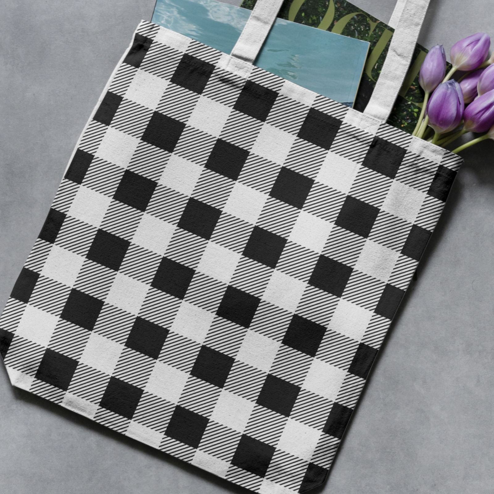 Canvas tote bag mockup with a black and white buffalo check pattern from the Essential Geo seamless digital paper collection.