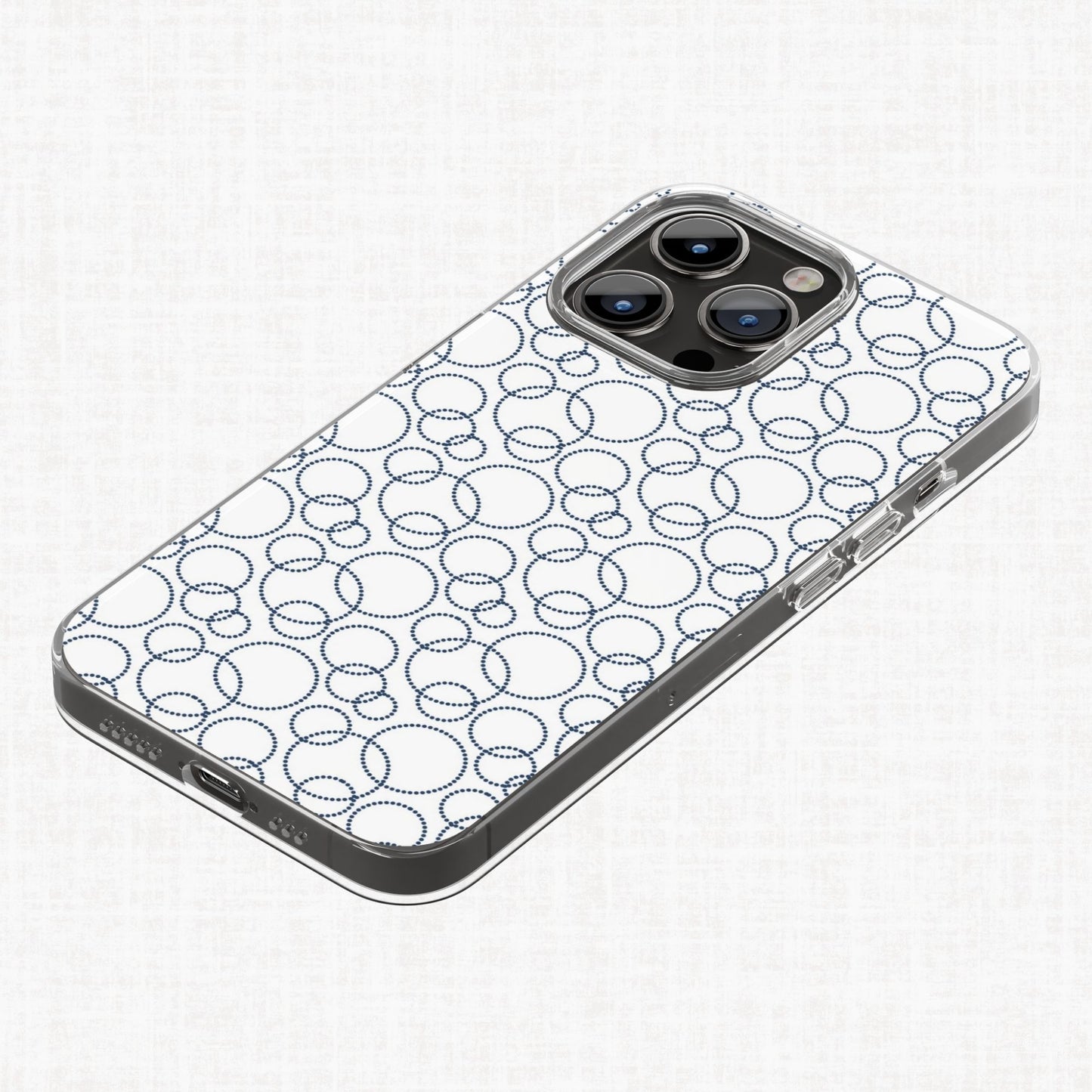 Navy dotted circle pattern applied to a phone case as a finished print-on-demand example.